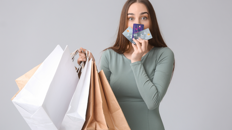Woman holding shopping bags kissing cards
