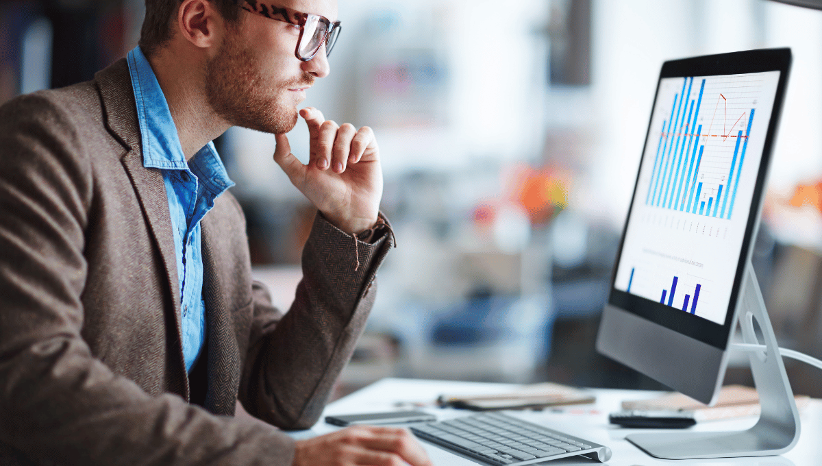 man monitoring the chart on his computer
