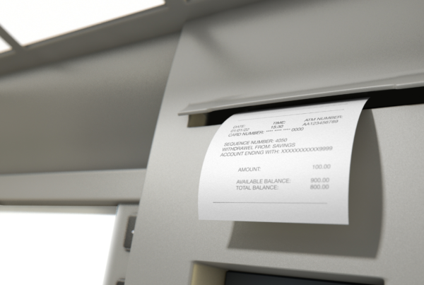 A withdrawal receipt coming out of an ATM