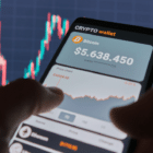 Two hands holding a phone with a crypto wallet app open.
